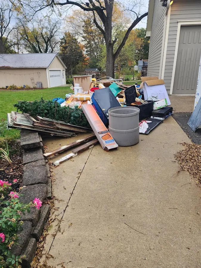 Dumpster being loaded with debris for 12 Yard Dumpster Rental in Attica
